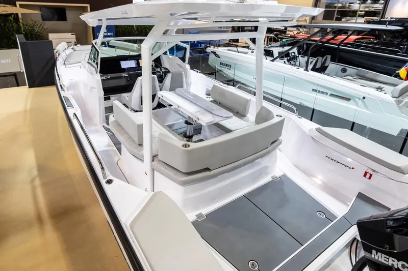 Slide: The Image of 2025 Axopar 29 Sun Top boat with sleek design and spacious seating. - 7