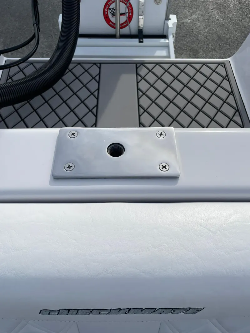 Slide: The Image of 2025 Checkmate Pulsare 2400 BRX boat deck with mounting bracket and textured surface. - 22