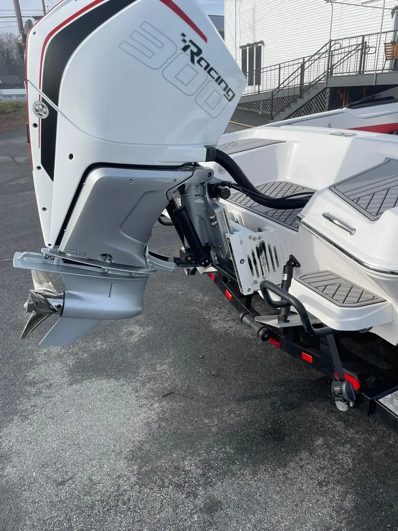 Slide: The Image of 2025 Checkmate Pulsare 2400 BRX boat with powerful outboard motor. - 5