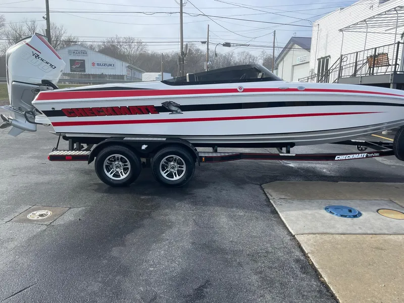 Slide: The Image of 2025 Checkmate Pulsare 2400 BRX boat on trailer, side view. - 6