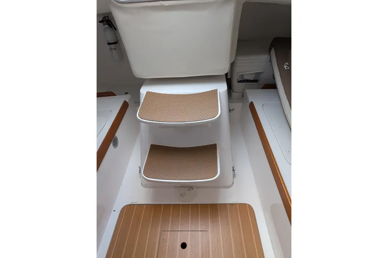 Slide: The Image of Interior steps of a 2016 J Boats J 95 sailboat with wooden accents. - 12