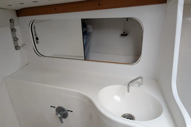 Slide: The Image of Interior cabin of 2016 J Boats J 95 sailboat, featuring a hatch and storage area. - 17