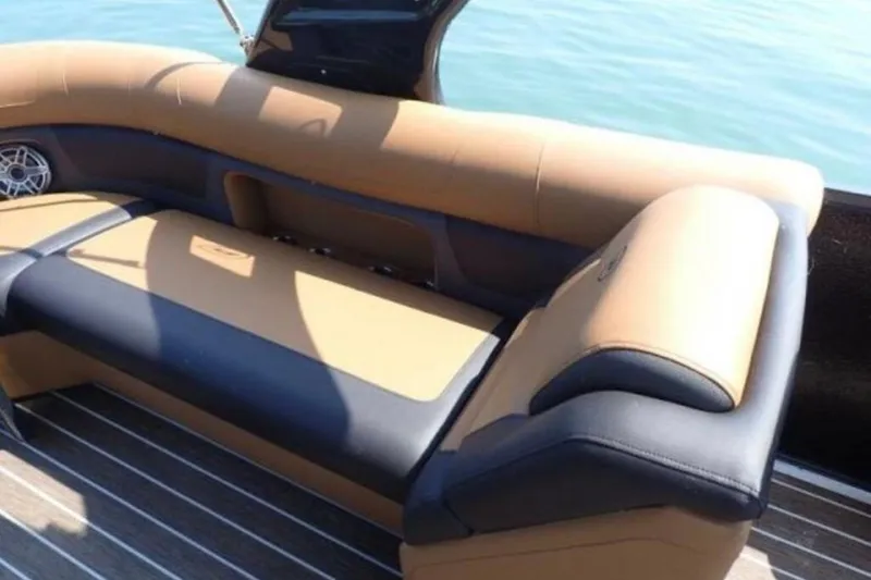 Slide: The Image of Luxurious seating on 2025 Premier 250 Solaris RF boat, featuring tan and black upholstery. - 5