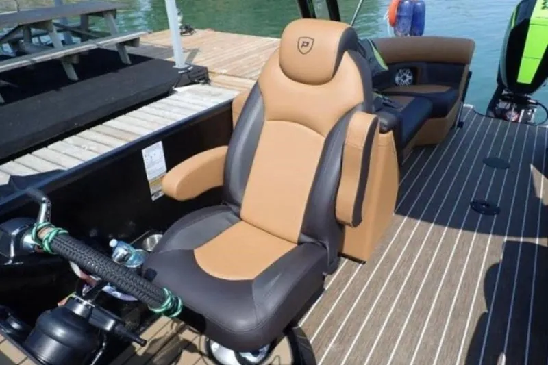 Slide: The Image of Luxurious seating on 2025 Premier 250 Solaris RF boat, featuring tan and black upholstery. - 7