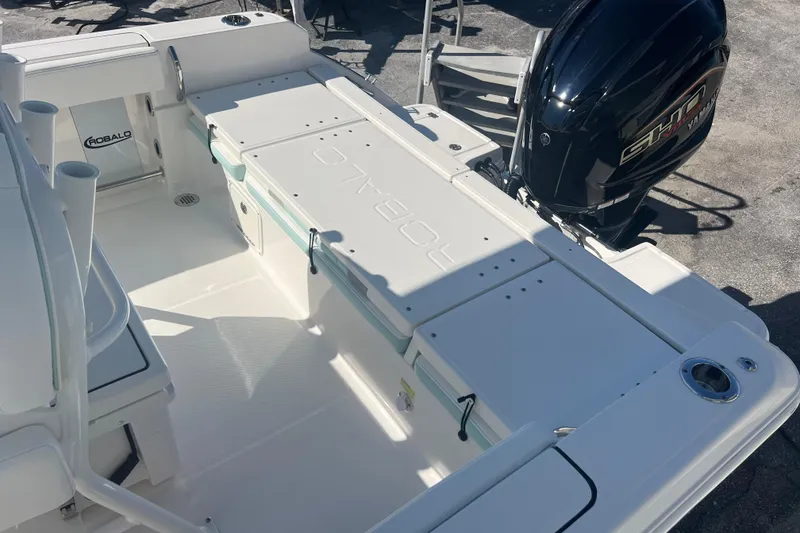 Slide: The Image of 2024 Robalo R232 Explorer boat interior with Yamaha engine, showcasing spacious deck design. - 18