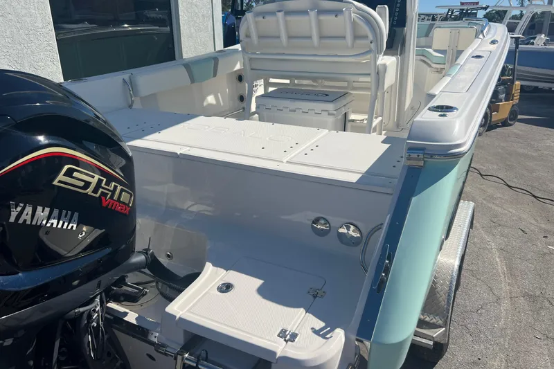 Slide: The Image of 2024 Robalo R232 Explorer boat with Yamaha SHO VMAX engine, docked outdoors. - 5