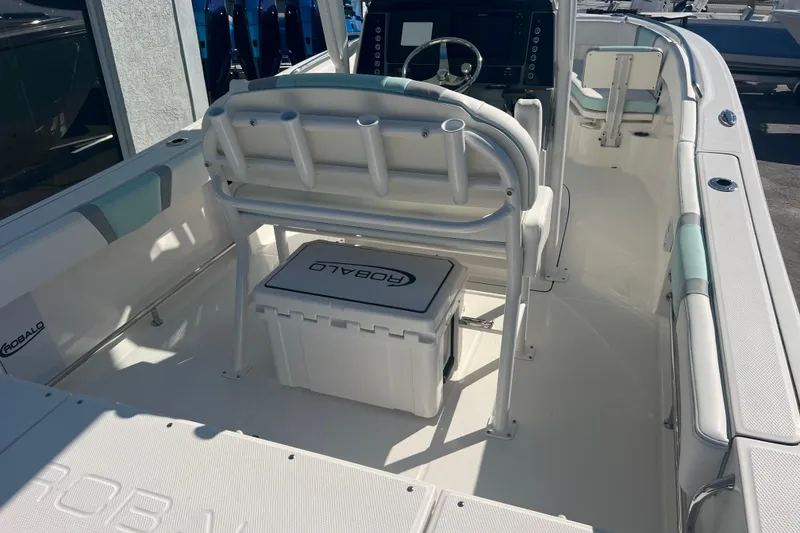 Slide: The Image of 2024 Robalo R232 Explorer boat interior with seating and console. - 7