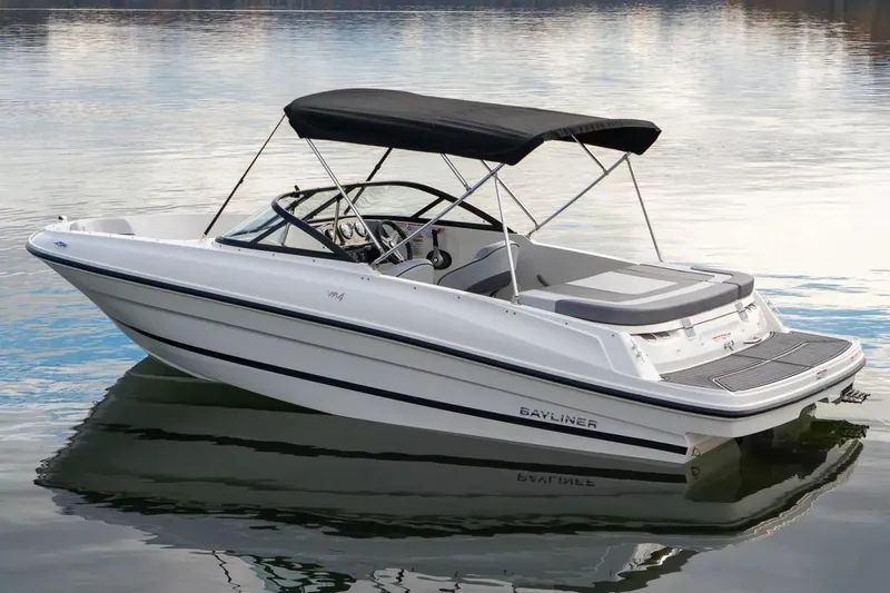 Slide: The Image of 2025 Bayliner VR4 Bowrider OB on trailer, featuring sleek design and Mercury outboard motor. - 1