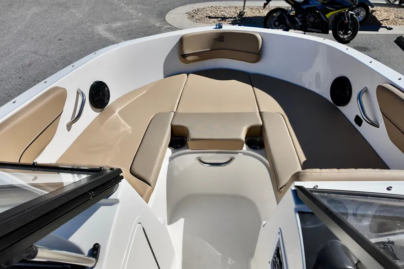 Slide: The Image of 2025 Bayliner VR4 Bowrider OB interior with beige seating and modern design. - 11