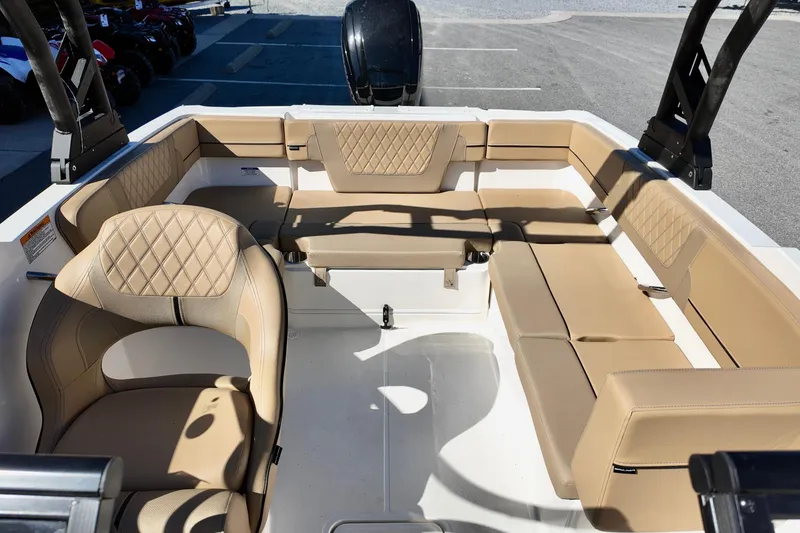 Slide: The Image of 2025 Bayliner VR4 Bowrider OB interior with beige seating and modern design. - 7