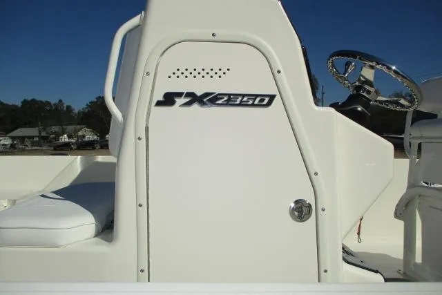 Slide: The Image of 2026 Skeeter SX2350 boat console with steering wheel and seating. - 10