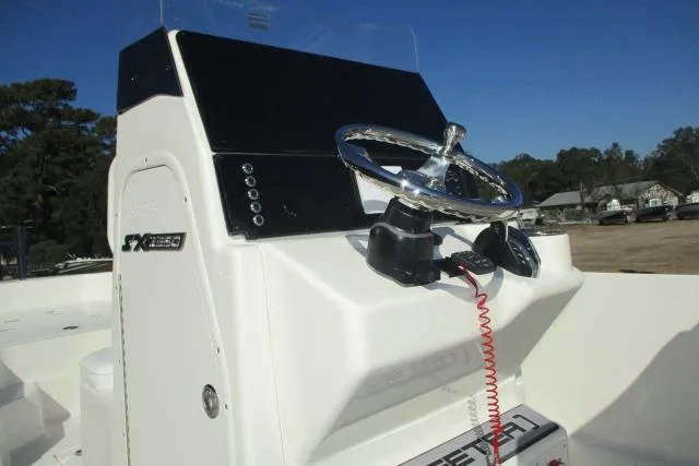 Slide: The Image of 2026 Skeeter SX2350 boat console with steering wheel and controls. - 15