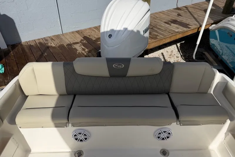 Slide: The Image of 2026 Key West 239 FSR boat seating with Yamaha engine in background. - 13