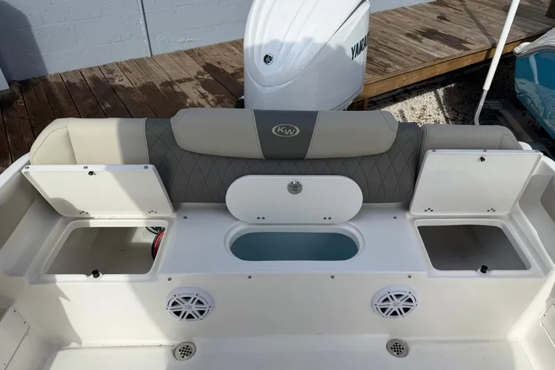 Slide: The Image of 2026 Key West 239 FSR boat interior with storage compartments and seating. - 15