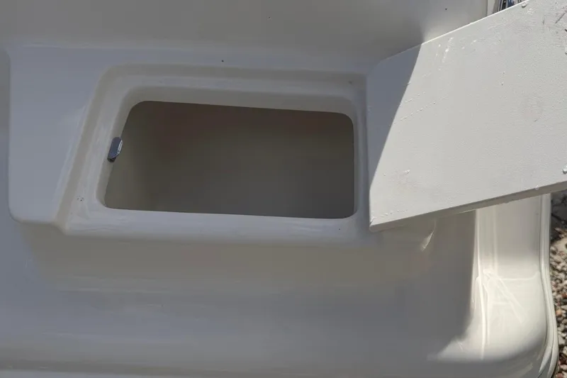 Slide: The Image of Open storage compartment on 2026 Key West 239 FSR boat. - 18