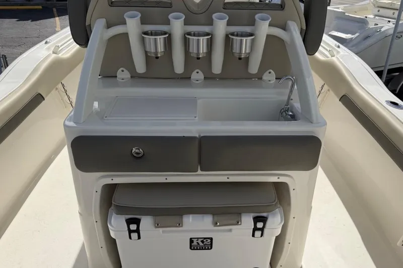 Slide: The Image of 2026 Key West 239 FSR boat console with rod holders, cup holders, and sink. - 19