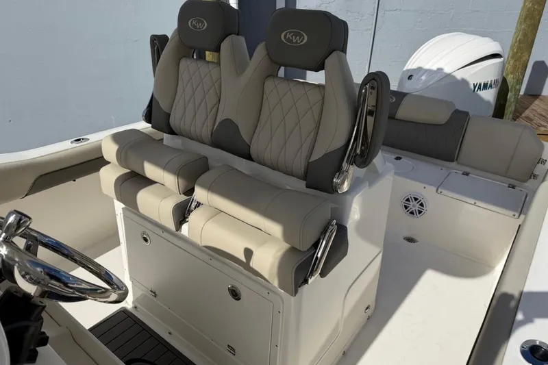 Slide: The Image of 2026 Key West 239 FSR boat interior with dual seats and Yamaha engine. - 22