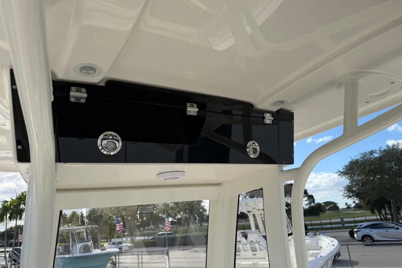 Slide: The Image of 2026 Key West 239 FSR boat interior with storage compartment and sleek design. - 33