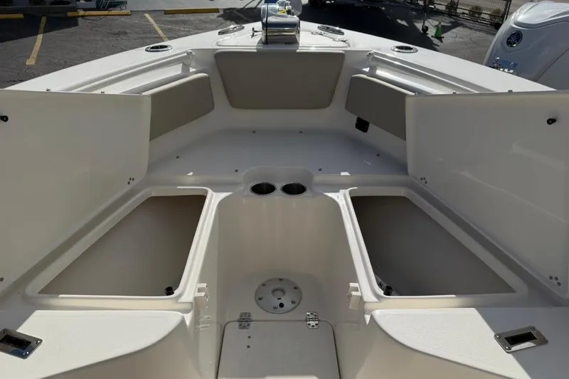 Slide: The Image of 2026 Key West 239 FSR boat interior with open storage compartments and seating. - 37