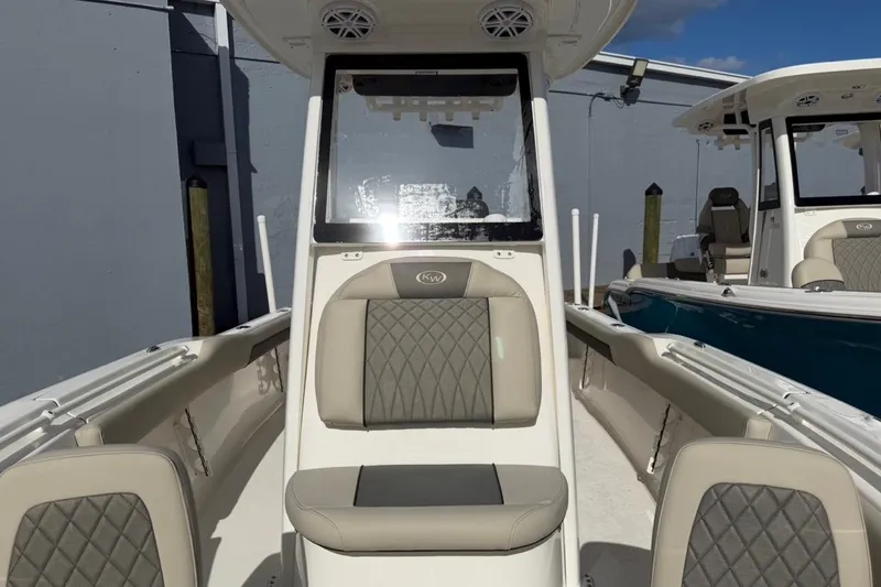 Slide: The Image of 2026 Key West 239 FSR boat interior with cushioned seating and modern design. - 40