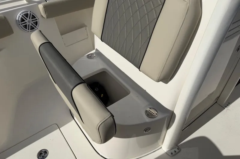 Slide: The Image of Key West 239 FSR 2026 boat seat with storage compartment and speaker. - 41