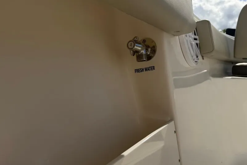 Slide: The Image of Fresh water outlet on 2026 Key West 239 FSR boat, beige interior. - 48