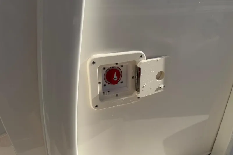 Slide: The Image of Emergency switch on 2026 Key West 239 FSR boat, partially open cover. - 50