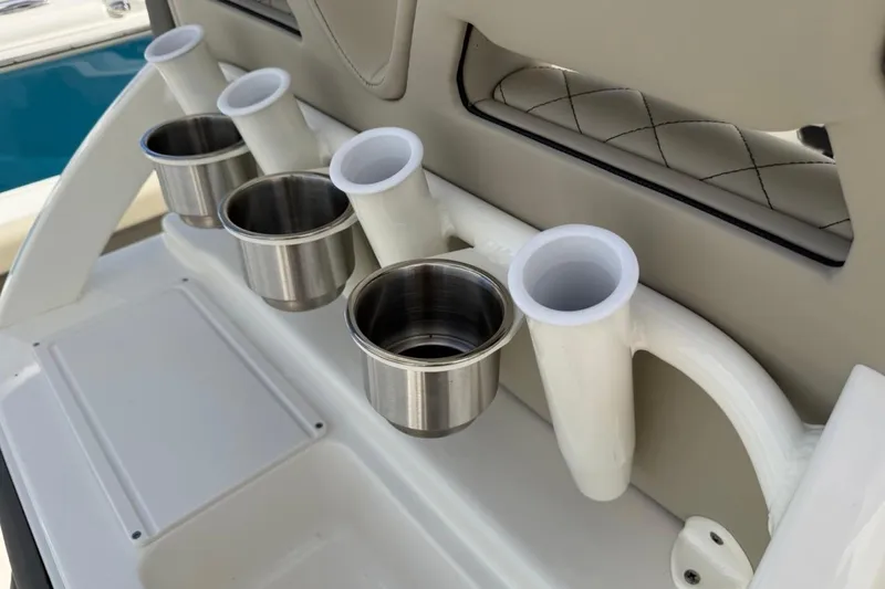 Slide: The Image of Cup holders and rod holders on 2026 Key West 239 FSR boat interior. - 51
