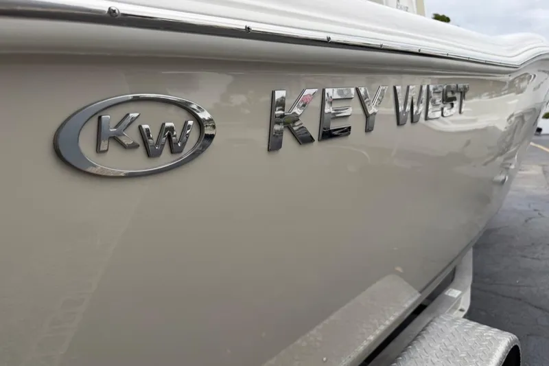 Slide: The Image of 2026 Key West 239 FSR boat with chrome logo on hull. - 57