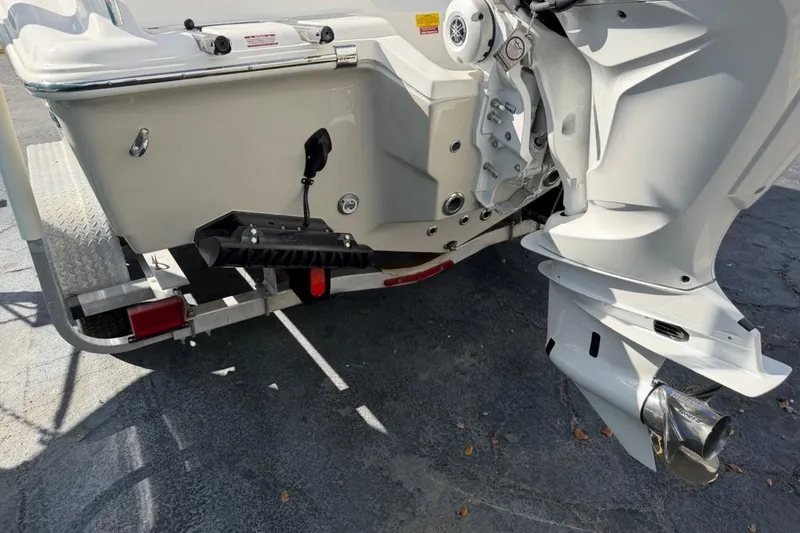 Slide: The Image of Rear view of 2026 Key West 239 FSR boat on trailer, showcasing outboard motor and hull details. - 7