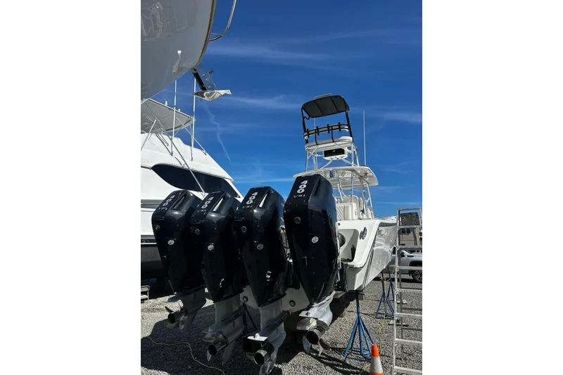 Slide: The Image of 2023 Front Runner 39 Center Console boat with four powerful outboard engines. - 2