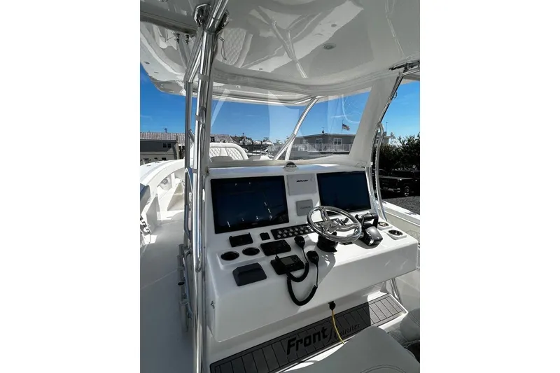 Slide: The Image of 2023 Front Runner 39 Center Console boat dashboard with modern navigation equipment. - 3