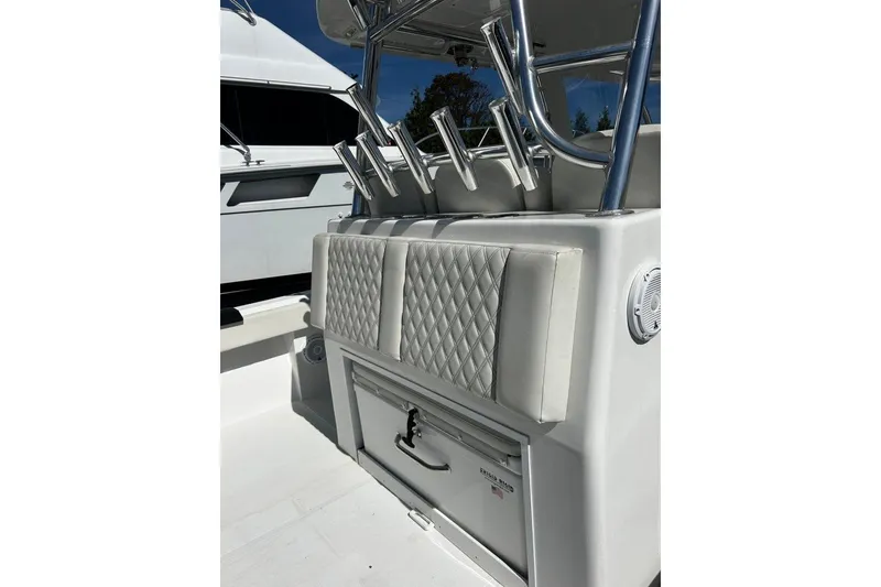 Slide: The Image of 2023 Front Runner 39 Center Console with diamond-stitched seating and rod holders. - 8