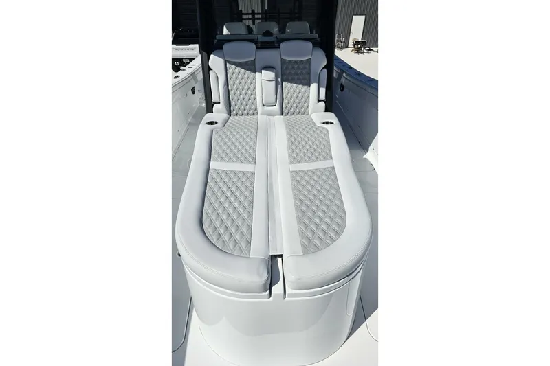 Slide: The Image of Luxurious seating on 2025 Costa Custom Boats 34ST, featuring elegant diamond-pattern upholstery. - 13
