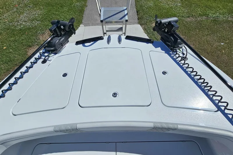 Slide: The Image of 2025 Costa Custom Boats 34ST deck view with fishing rod holders and storage compartments. - 18