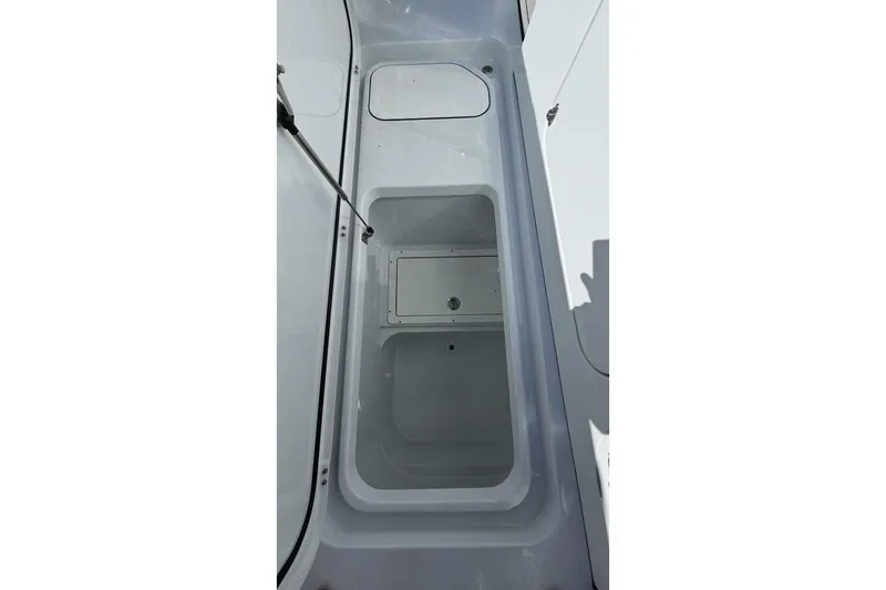 Slide: The Image of 2025 Costa Custom Boats 34ST interior compartment, showcasing sleek design and spacious storage. - 23