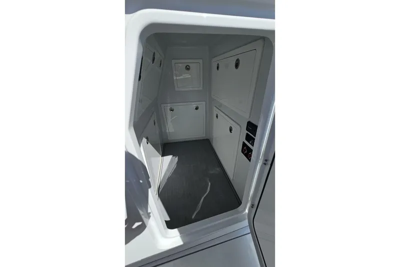 Slide: The Image of Interior view of 2025 Costa Custom Boats 34ST, featuring sleek storage compartments. - 24
