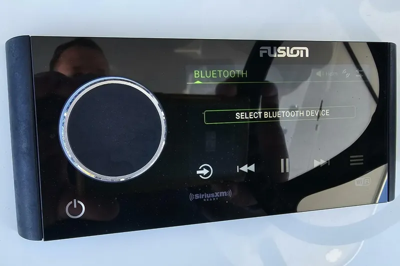 Slide: The Image of Fusion Bluetooth audio system on 2025 Costa Custom Boats 34ST, displaying device selection screen. - 33