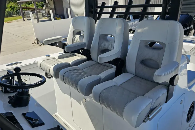 Slide: The Image of Luxury seating on 2025 Costa Custom Boats 34ST, featuring plush white upholstery and modern design. - 42