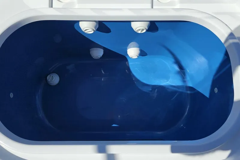 Slide: The Image of Livewell in 2025 Costa Custom Boats 34ST, featuring a sleek blue interior design. - 45