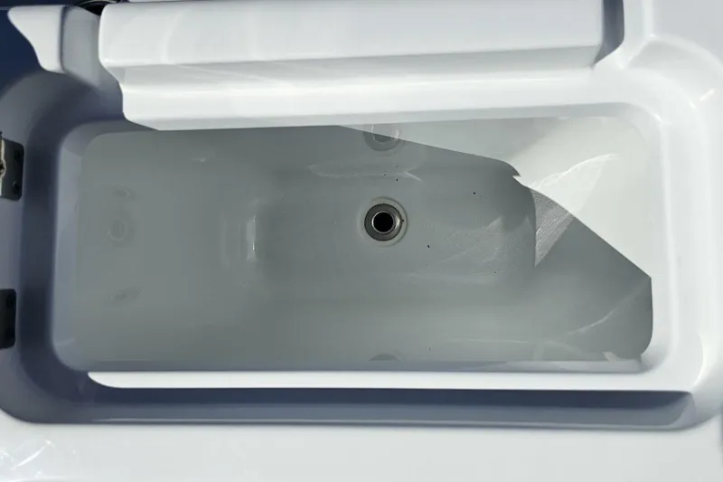 Slide: The Image of Livewell compartment of 2025 Costa Custom Boats 34ST, featuring a sleek, white interior design. - 46