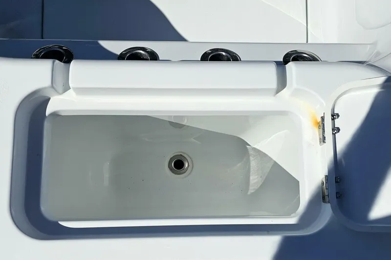 Slide: The Image of 2025 Costa Custom Boats 34ST livewell with rod holders, showcasing sleek design and functionality. - 47