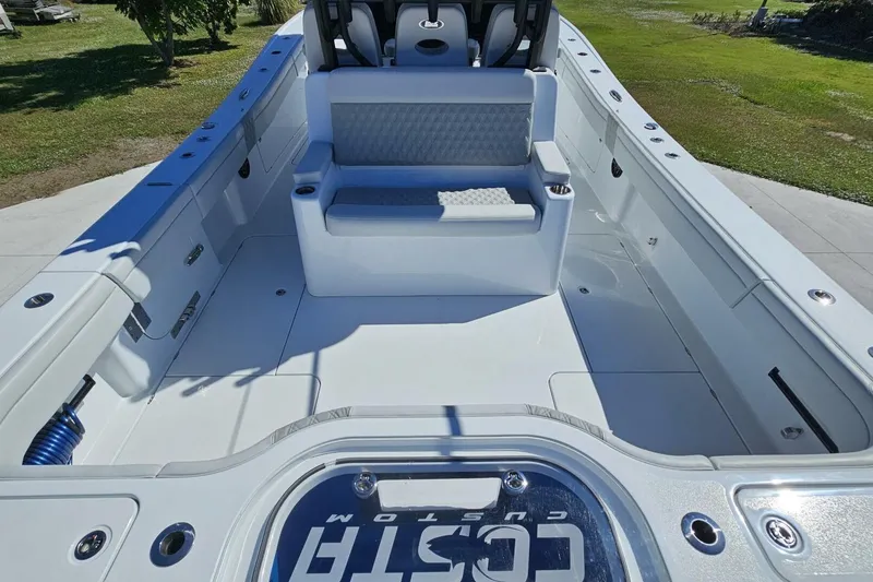 Slide: The Image of 2025 Costa Custom Boats 34ST interior, featuring spacious seating and sleek design. - 48
