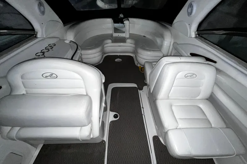 Slide: The Image of 2004 Sea Ray 290 Bowrider interior with white seating and modern design. - 22