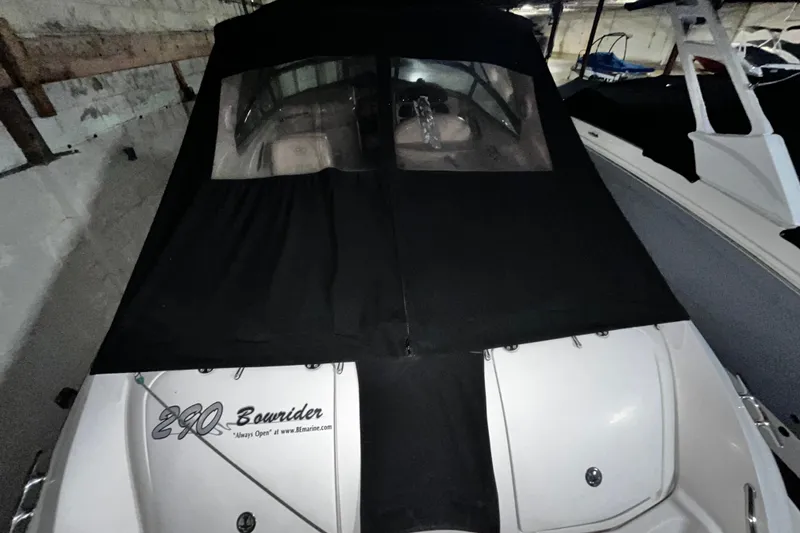 Slide: The Image of 2004 Sea Ray 290 Bowrider covered in storage, showcasing sleek design. - 8