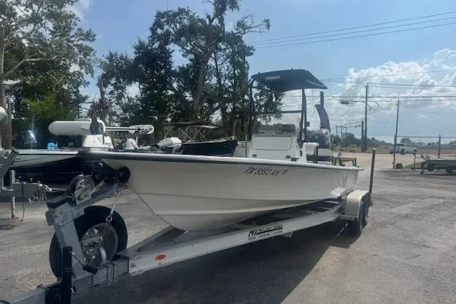 Slide: The Image of 2007 Haynie 23 Bigfoot boat on trailer in outdoor setting. - 10