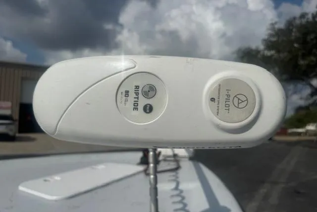 Slide: The Image of Minn Kota Riptide trolling motor on 2007 Haynie 23 Bigfoot boat under cloudy sky. - 14