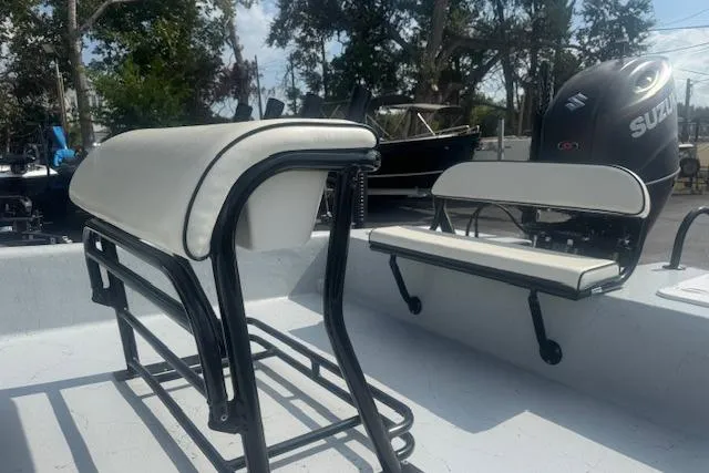 Slide: The Image of 2007 Haynie 23 Bigfoot boat interior with seating and Suzuki outboard motor. - 16