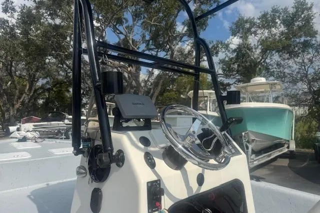 Slide: The Image of 2007 Haynie 23 Bigfoot boat console with steering wheel and navigation equipment. - 17