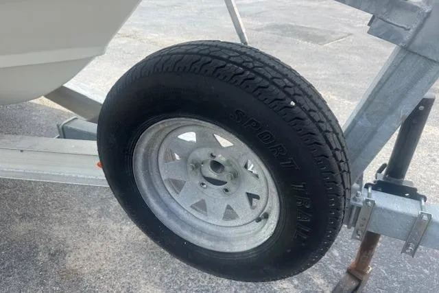 Slide: The Image of Trailer tire of a 2007 Haynie 23 Bigfoot boat on a concrete surface. - 25